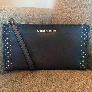 Navy Michael kors clutch/wristlet with gold accents, pocket and six card slots